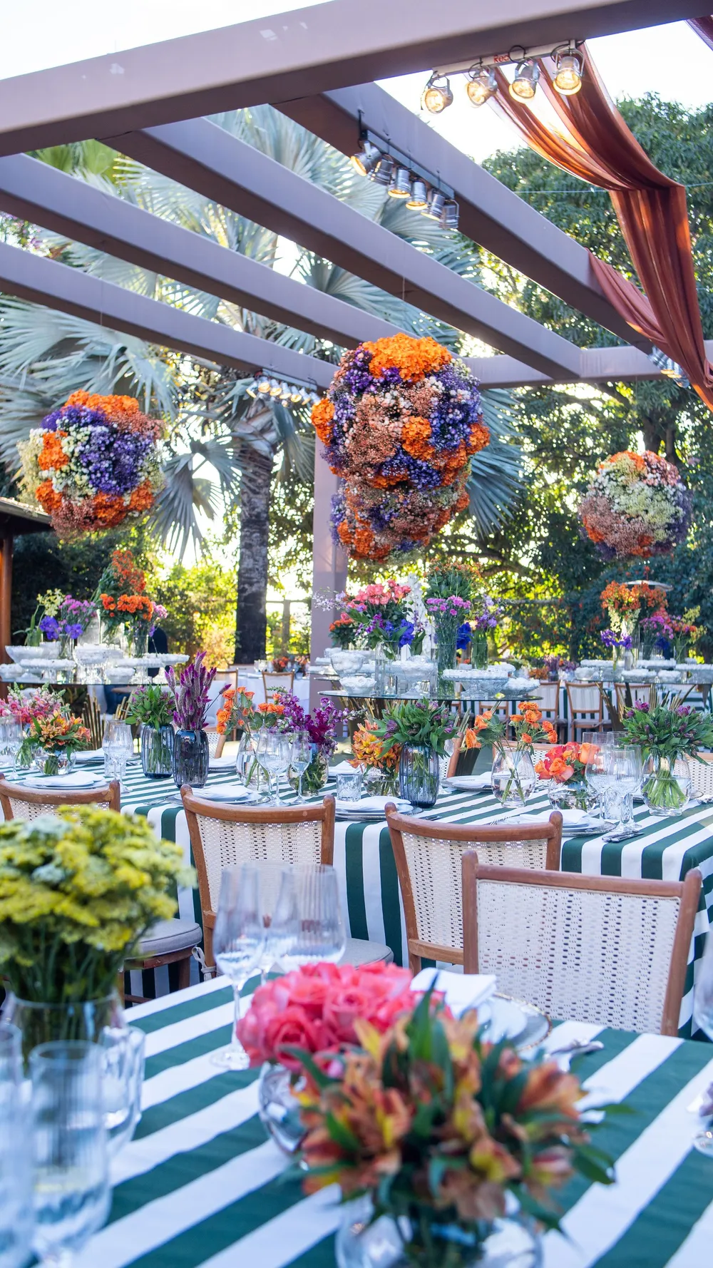 Reception tables with colorful floral centerpieces